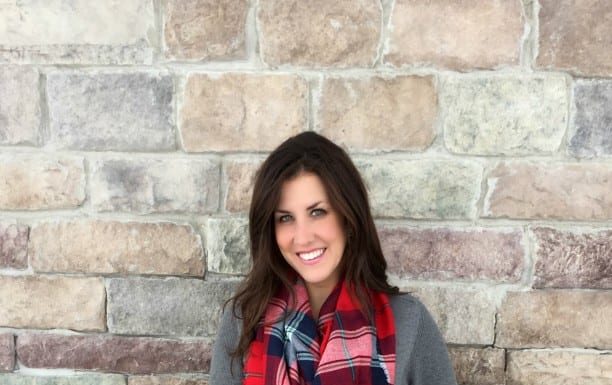Christmas outfit ideas - wear a red plaid scarf with a comfortable shirt, jeans and boots for a casual but stylish outfit.
